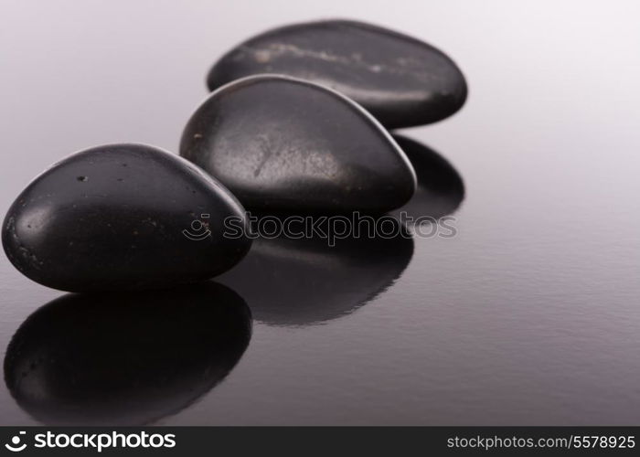 Spa stone arrangement on black surface