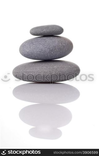 Spa stones with reflection isolated on white