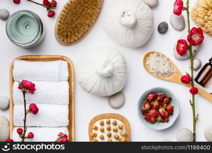 Spa treatment concept, flat lay composition with natural cosmetic products and massage brushes, view from above. Spa treatment concept, flat lay composition with natural cosmetic products and massage brushes