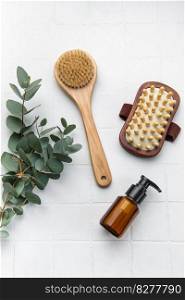 Spa treatment concept. natural spa cosmetics products with eucalyptus oil,, massage brush, eucalyptus leaf. Massage and spa concept