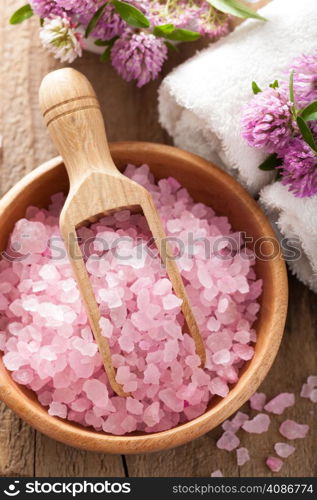 spa with pink herbal salt and clover flowers