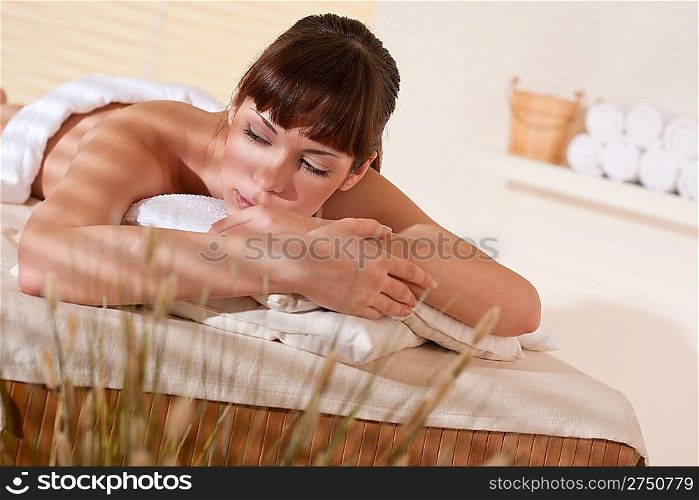 Spa - Young woman at wellness therapy waiting for massage