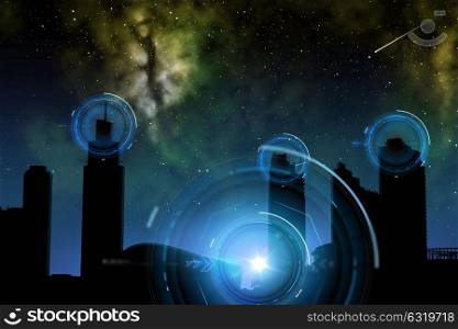 space and future technology concept - futuristic city skyscrapers over night sky background and holograms. city of future over space and holograms