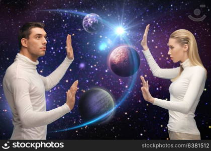 space, future and people concept - futuristic couple over planet and stars background. futuristic couple over planet and stars in space