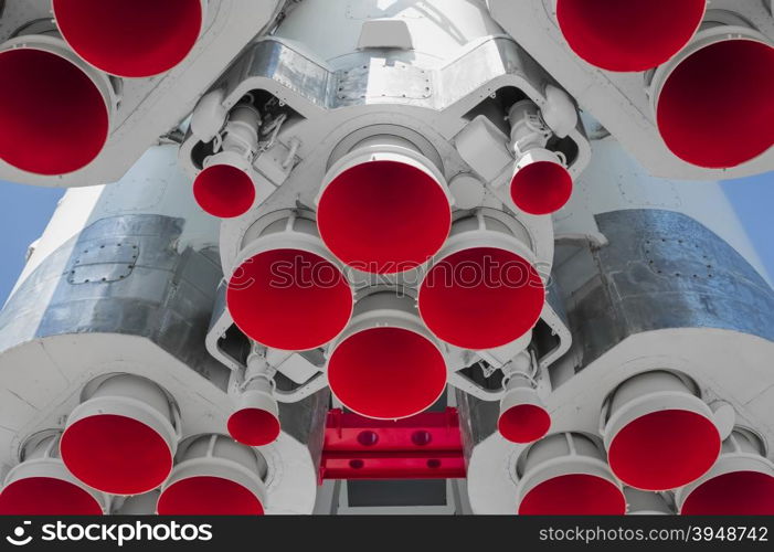 Space rocket engine on blue sky background. Space rocket engine