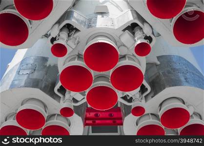 Space rocket engine on blue sky background. Space rocket engine