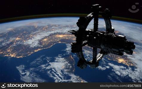 Space Station Orbiting Earth. Elements of this image furnished by NASA.