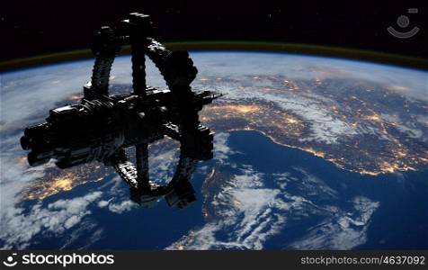 Space Station Orbiting Earth. Elements of this image furnished by NASA.