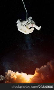 Space suits on space background. Elements of this image furnished by NASA.