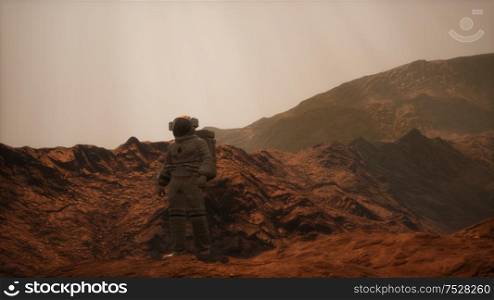 Spaceman walks on the red planet Mars. Space Mission. Astronaut travel in space. Spaceman walks on the red planet Mars. Space Mission