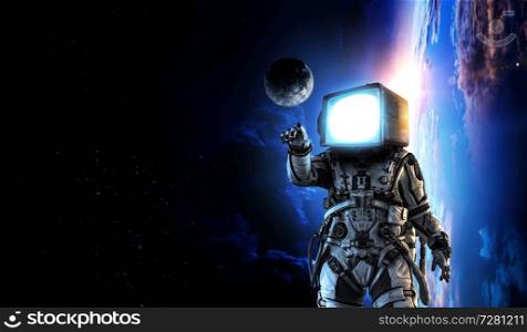 Spaceman with old monitor instead of head. Elements of this image furnished by NASA. Monitor headed astronaut