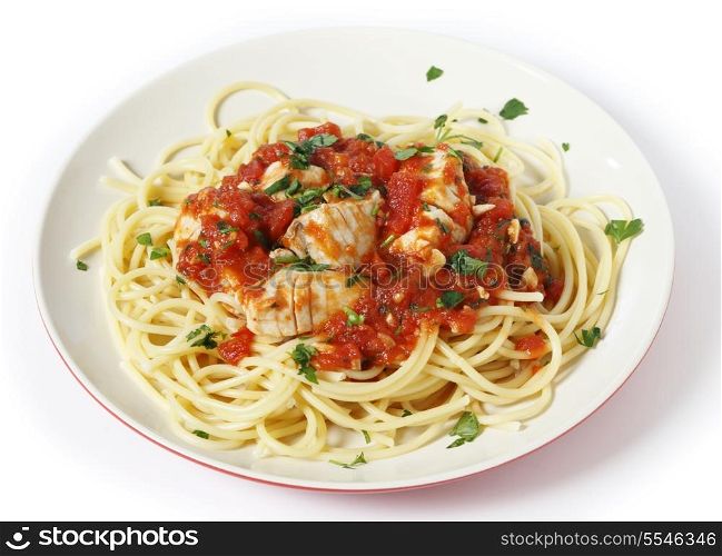 Spaghetti all&rsquo;arrabbiata with fish, garnished with parsley. The sauce is made from tomato, garlic, olive oil and flaked chillis.