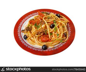 Spaghetti alla puttanesca salty Italian pasta dish.ingredients are typical of Southern Italian cuisine: tomatoes, olive oil, olives, capers and garlic. isolated on white background.
