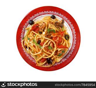 Spaghetti alla puttanesca salty Italian pasta dish.ingredients are typical of Southern Italian cuisine: tomatoes, olive oil, olives, capers and garlic. isolated on white background.