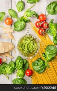 spaghetti and basil pesto, ingredients for cooking, top view
