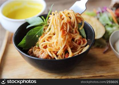 spaghetti and meatballs on wood background italian food