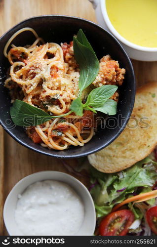 spaghetti and meatballs on wood background italian food