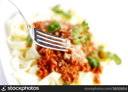 Spaghetti bolognese and fork