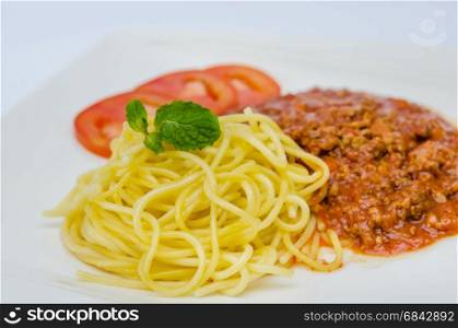 Spaghetti Bolognese meal . Spaghetti Bolognese meal with basil leaves and tomatoes