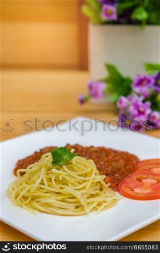 Spaghetti Bolognese meal . Spaghetti Bolognese meal with basil leaves and tomatoes