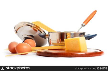spaghetti, eggs and kitchen utensil on white background