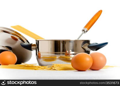 spaghetti, eggs and kitchen utensil, white background