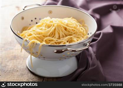 spaghetti in colander
