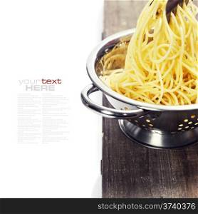 spaghetti in colander over white (with easy removable sample text)