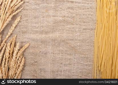 Spaghetti on the burlap background and ears