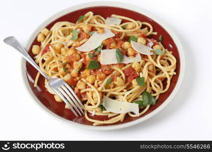 Spaghetti with a chickpea, tomato and chilli flakes sauce, garnished with fresh torn basil leaves and flakes of parmesan. This is a traditional Italian dish, which comes in many variations, with or without tomate or with chickpeas wholly or partly crushed into the sauce. It is called spaghetti alla ceci