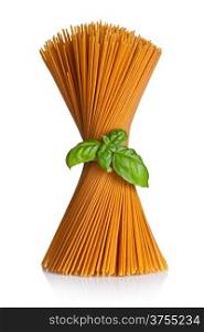 Spaghetti with basil isolated on white background. Bunch of whole wheat pasta