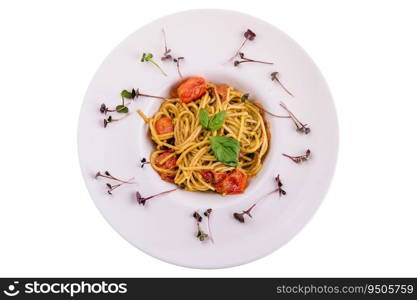 Spaghetti with colorful stewed cherry tomatoes, basil and pesto sauce