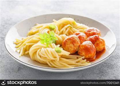 Spaghetti with meatballs in tomato sauce