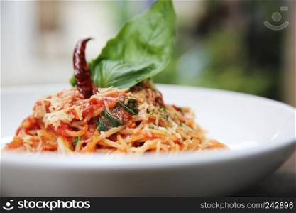Spaghetti with tomato sauce and fresh basil on wood , Italian pasta