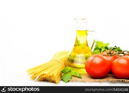 Spaghetti with tomatoes, olive oil and basil isolated on white
