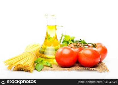 Spaghetti with tomatoes, olive oil and basil isolated on white