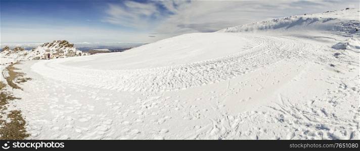 Spain, Andalusia, Granada. Panoramic view of ski resort of Sierra Nevada in winter, full of snow. Travel and sports concepts.. Ski resort of Sierra Nevada in winter, full of snow.