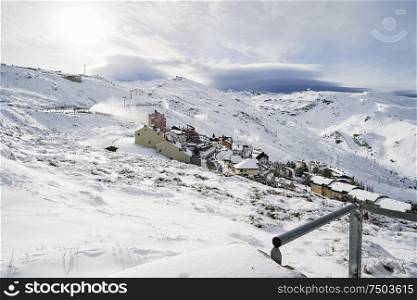 Spain, Andalusia, Granada. Ski resort of Sierra Nevada in winter, full of snow. Travel and sports concepts.. Ski resort of Sierra Nevada in winter, full of snow.