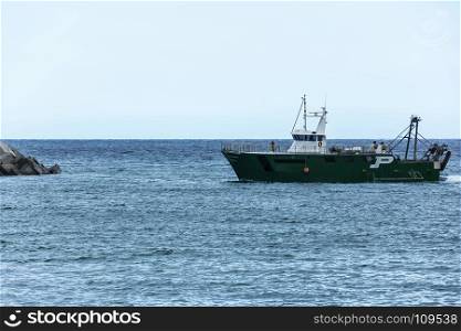 Spain, Blanes - September 14, 2017: Fishing boat on the background of the sea horizon