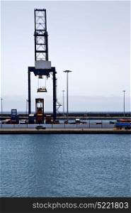 spain crane and harbor pier boat in the blue sky arrecife teguise lanzarote