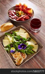 Spain food tapas ham sausage and salad with cheese honey and nuts