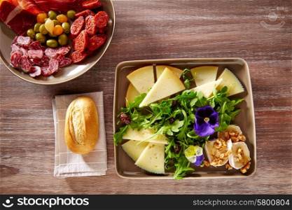 Spain food tapas ham sausage and salad with cheese honey and nuts