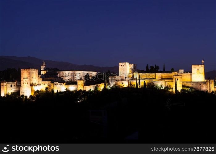 Spain, Granada. The famous Alhambra Royal Palace by night from the best viewpoint