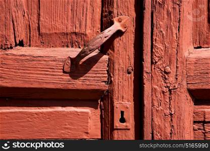 spain knocker lanzarote abstract door wood in the red brown