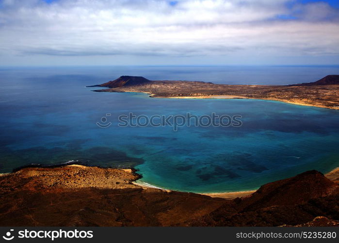 spain miramar del rio harbor rock stone sky cloud beach boat yacht water in lanzarote graciosa