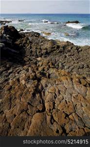 spain musk pond rock stone sky water coastline and summer in lanzarote