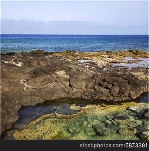 spain musk pond rock stone sky water coastline and summer in lanzarote &#xA;