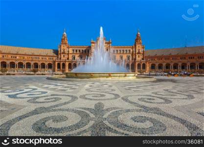 Spain Square or Plaza de Espana in Seville in the sunny summer day, Andalusia, Spain. Paving stone pattern and fountain in the foreground, horse-drawn carriages in the distance