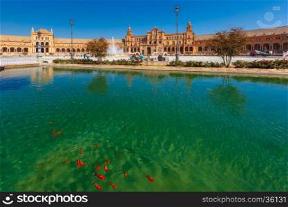 Spain Square or Plaza de Espana in Seville in the sunny summer day, Andalusia, Spain. Goldfish in the channel on the foreground