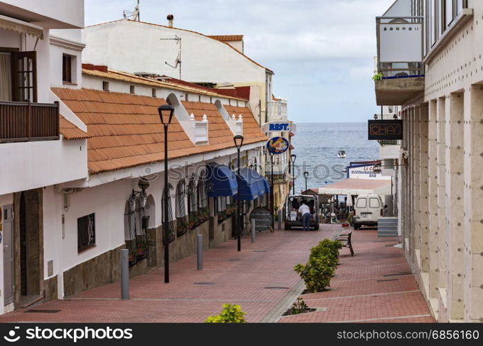 Spain, Tenerife - 10.09.2016: La Caleta village street leading to the shore of the ocean